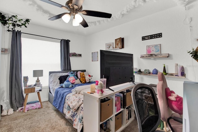 bedroom with ceiling fan and light colored carpet