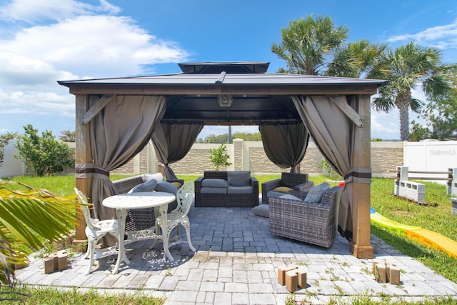 view of patio / terrace featuring an outdoor living space and a gazebo