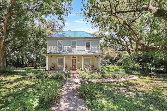 view of front of house with a front lawn and covered porch