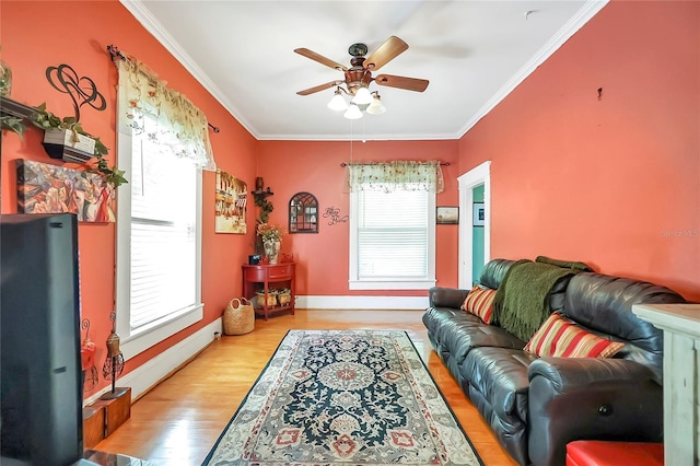 living room featuring light wood-type flooring, crown molding, and ceiling fan