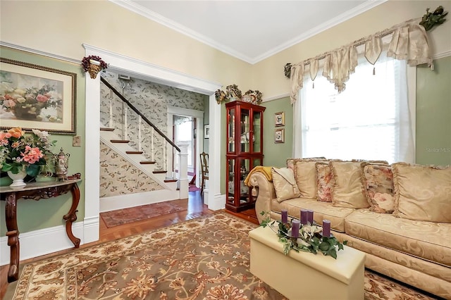 living room featuring hardwood / wood-style floors, crown molding, and plenty of natural light