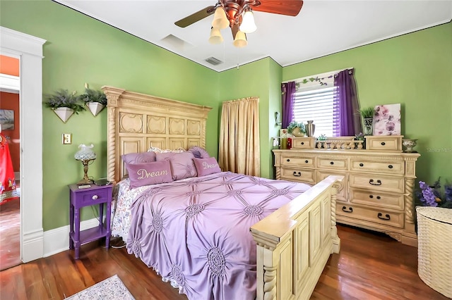 bedroom featuring ceiling fan and dark hardwood / wood-style floors