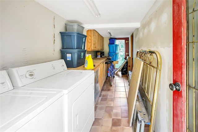 clothes washing area featuring tile patterned floors and independent washer and dryer