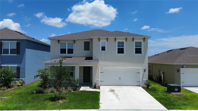 view of front property with a front yard and a garage