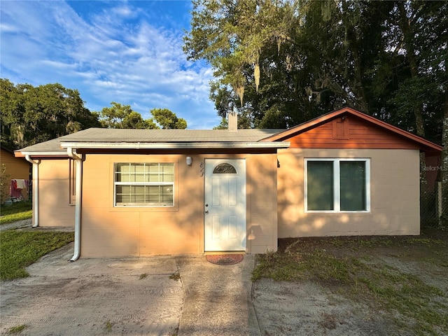 view of front facade with concrete block siding