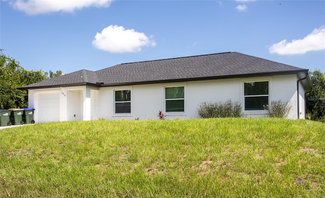 view of home's exterior featuring a garage and a lawn