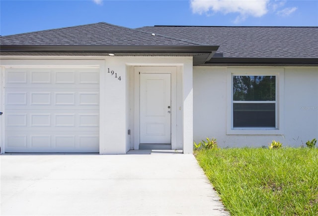 view of exterior entry featuring a garage