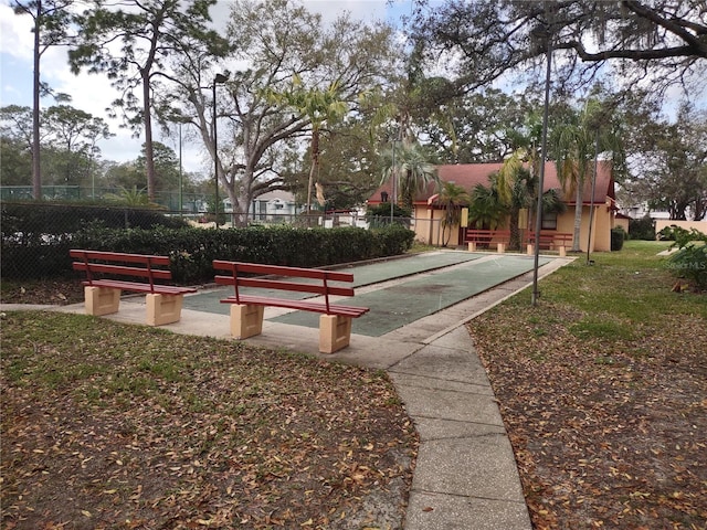 view of property's community featuring fence