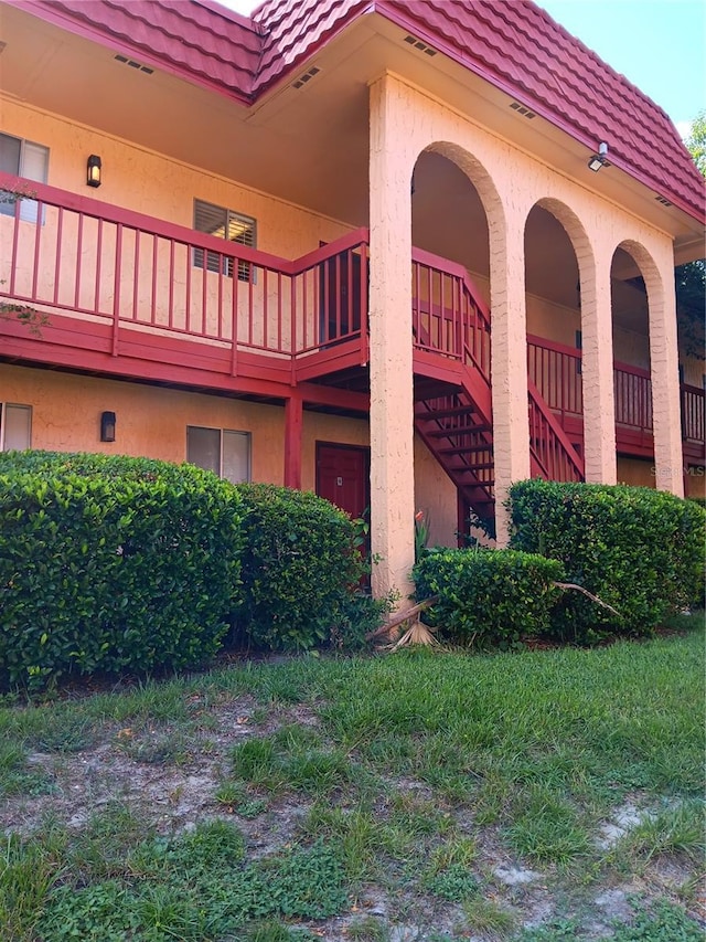 view of property featuring stairs