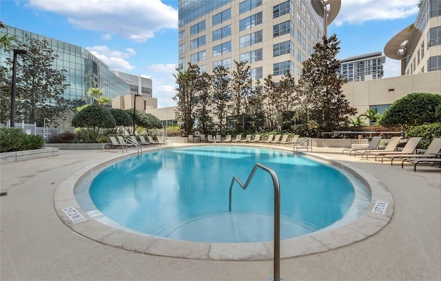 view of swimming pool featuring a patio