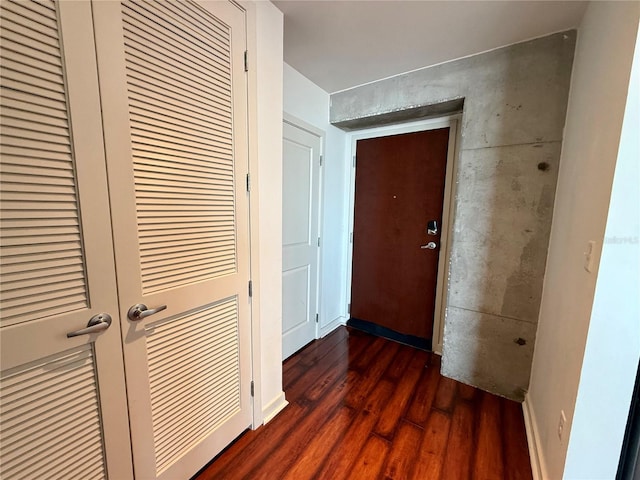 hallway with dark hardwood / wood-style floors