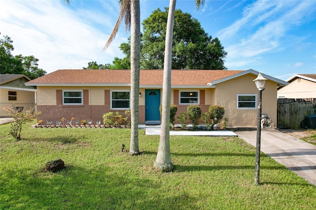 single story home featuring a front yard