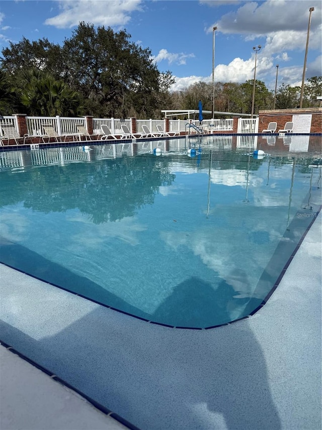 community pool with fence