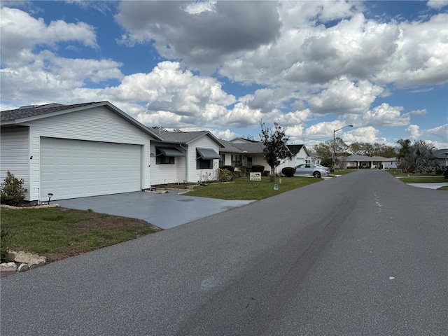 view of road featuring a residential view and street lights