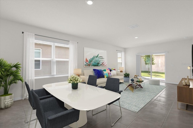 dining space featuring baseboards, visible vents, and recessed lighting