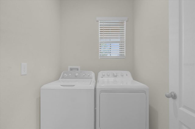 laundry room featuring laundry area and washer and clothes dryer