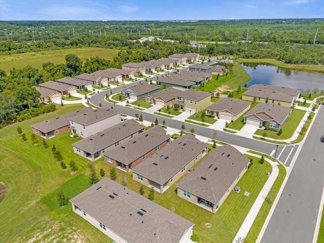 aerial view featuring a residential view, a water view, and a forest view