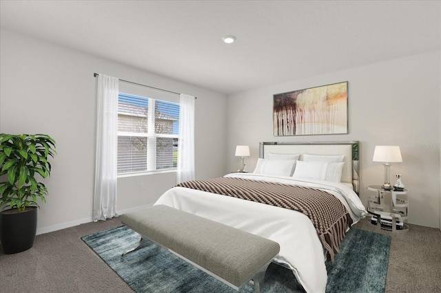 bedroom featuring carpet and baseboards