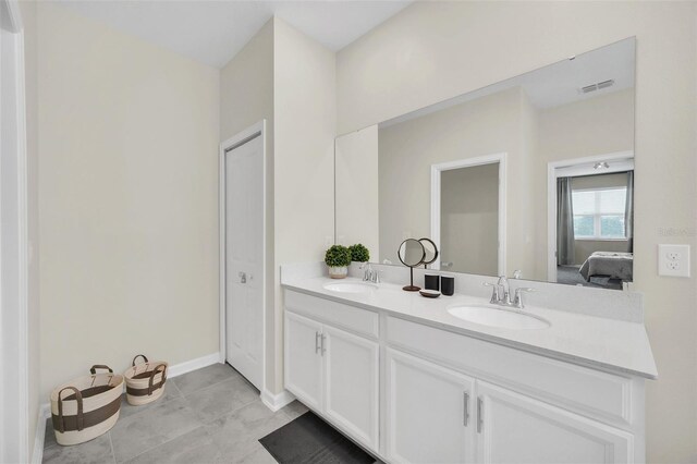 bathroom featuring double sink vanity and tile patterned floors