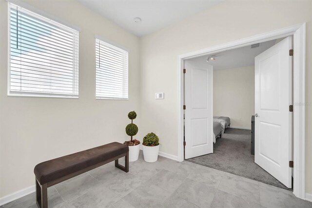 interior space with light tile patterned floors