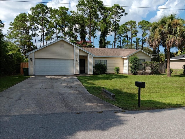 ranch-style house featuring a front lawn and a garage