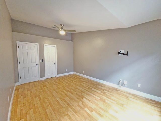 spare room with light wood-type flooring and ceiling fan