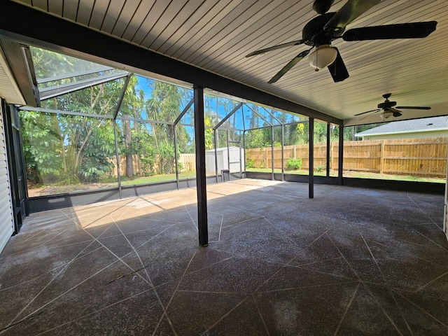 view of patio featuring a lanai and ceiling fan