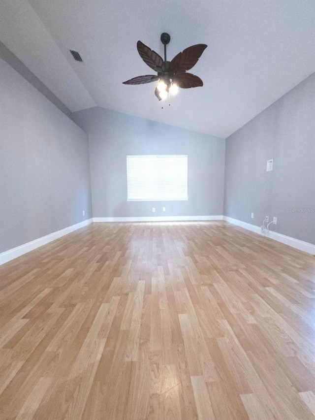 unfurnished room featuring ceiling fan, light hardwood / wood-style flooring, and lofted ceiling