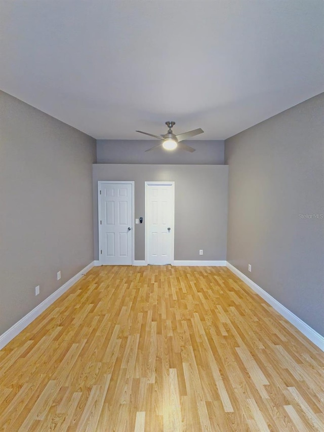 interior space with light wood-type flooring and ceiling fan