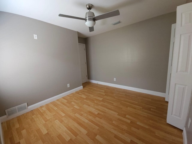 unfurnished room featuring light hardwood / wood-style flooring and ceiling fan