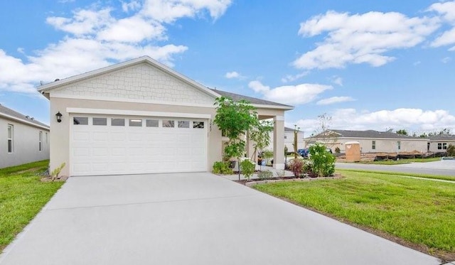 view of front facade with a front lawn and a garage