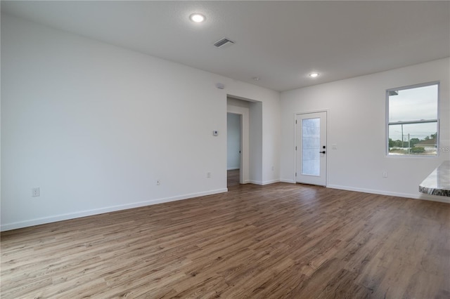 unfurnished room featuring hardwood / wood-style floors