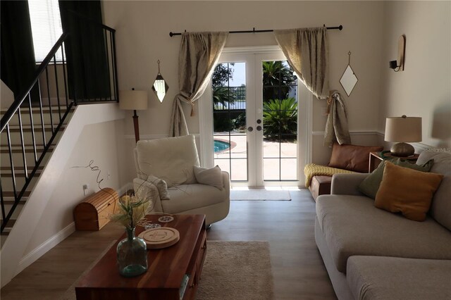 living room featuring french doors and hardwood / wood-style flooring