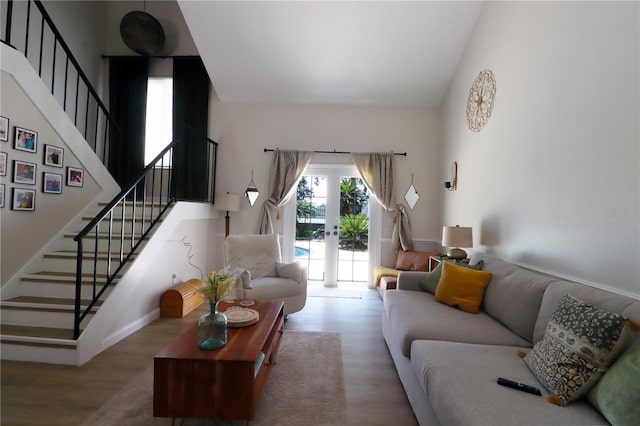 living room with wood-type flooring and french doors