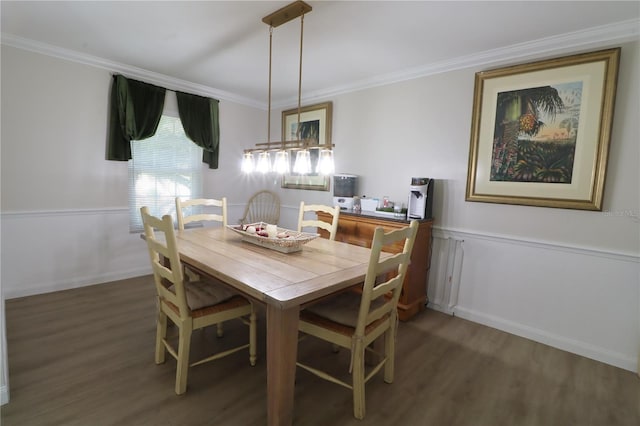 dining area featuring crown molding and dark hardwood / wood-style flooring