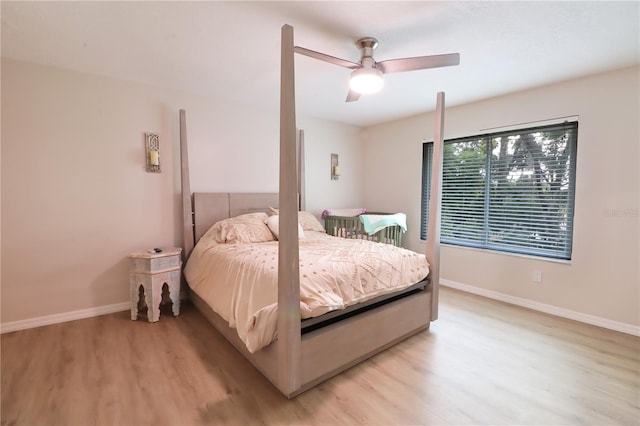 bedroom with light hardwood / wood-style flooring and ceiling fan