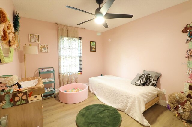 bedroom featuring ceiling fan and hardwood / wood-style flooring