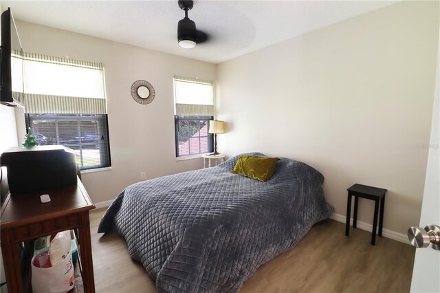 bedroom featuring ceiling fan and wood-type flooring