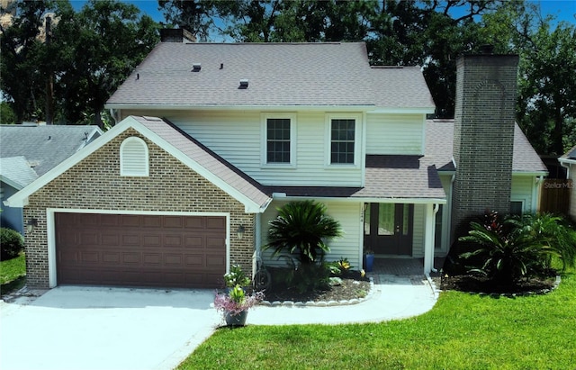 front facade with a front lawn, a porch, and a garage