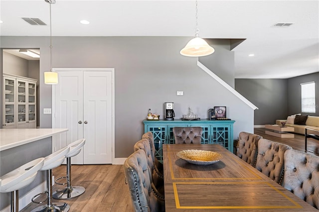 dining room with wood-type flooring