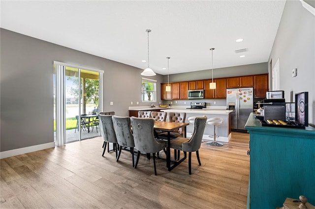 dining room with light wood-type flooring