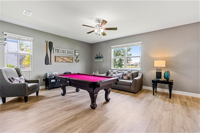 rec room featuring ceiling fan, light hardwood / wood-style floors, a textured ceiling, and pool table