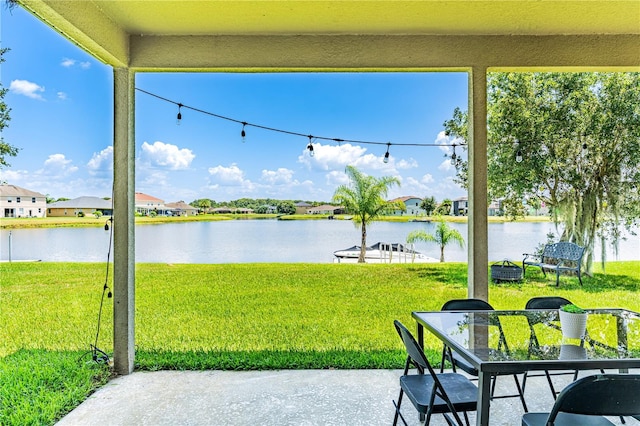 view of patio / terrace featuring a dock and a water view