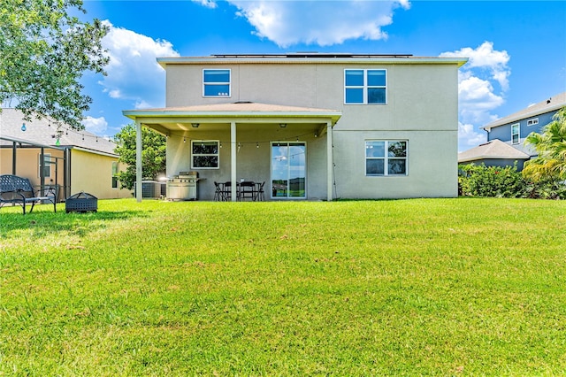 rear view of house with a yard