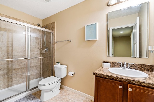 bathroom featuring a textured ceiling, tile patterned flooring, vanity, toilet, and a shower with door