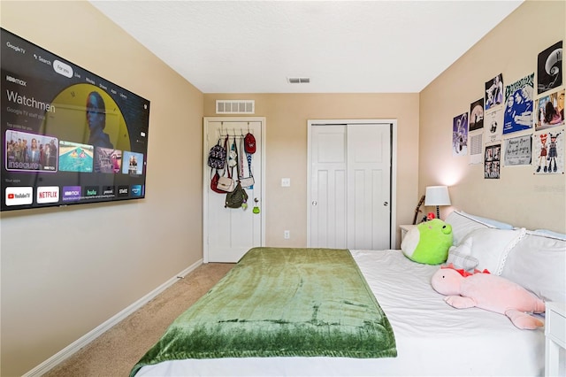 carpeted bedroom with a closet