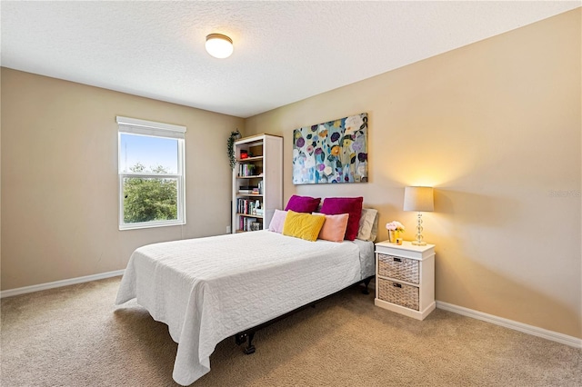 carpeted bedroom with a textured ceiling