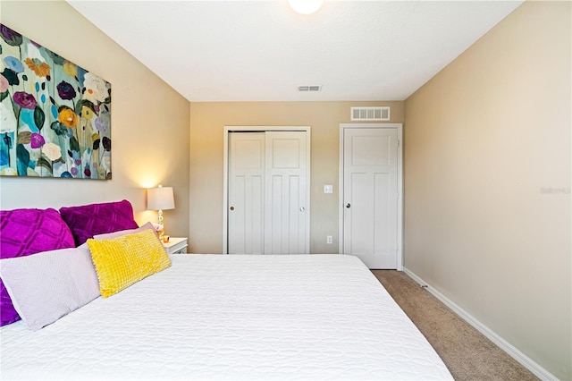 carpeted bedroom featuring a closet