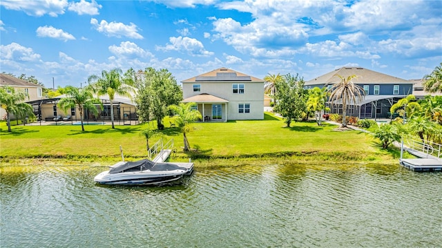 dock area with a lawn, a lanai, and a water view