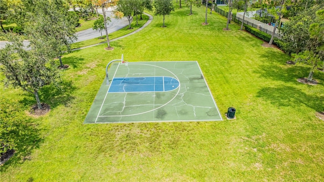 view of basketball court featuring a yard